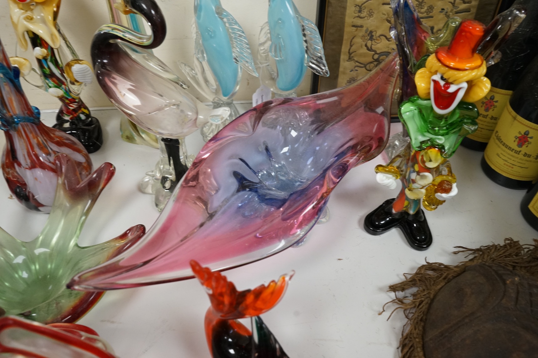 Two multi-coloured Murano glass clowns, a pair of 'fish' vases and modernist glassware, tallest 32cm